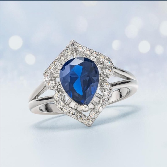 Stauer Jewelry - 18K White Gold-Finished Brass Sapphire & DiamondAura® Ring Pear-Cut Blue 2ctw 💎